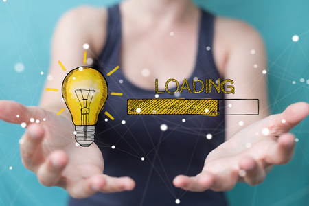 Businesswoman on blurred background holding and touching loading sketchの写真素材