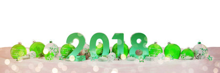 2018 new year eve with green and white christmas baubles and candles 3D rendering
