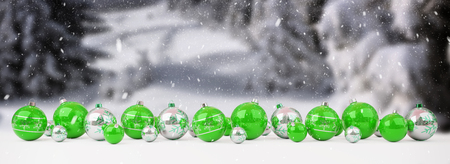 Green and white christmas baubles lined up on snow background 3D renderingの写真素材