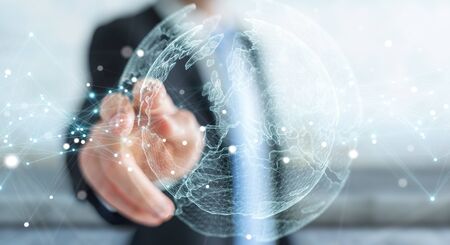 Businessman on blurred background using planet earth network sphere interface 3D renderingの写真素材