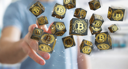 Businessman on blurred background using bitcoins cryptocurrency 3D renderingの写真素材