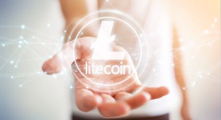 Businessman on blurred background using litecoins cryptocurrency 3D renderingの写真素材