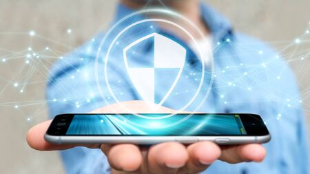 Businessman on blurred background using shield safe protection with connections 3D renderingの写真素材