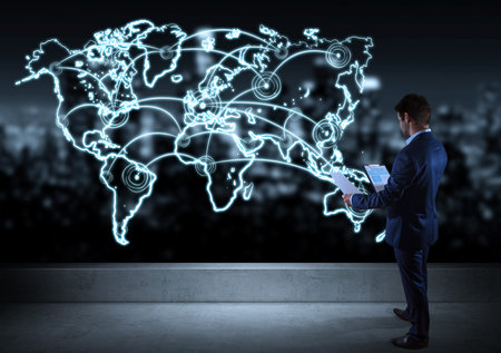 Businessman watching drawing manuscript world map connection l on a rooftop with a city view 3D renderingの写真素材