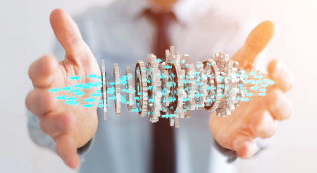 Businessman on blurred background using floating gear icons 3D rendering
