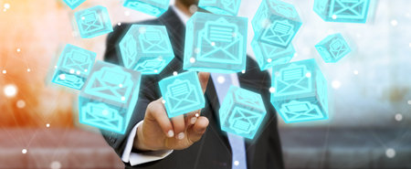 Businessman on blurred background using floating cube emails 3D renderingの写真素材