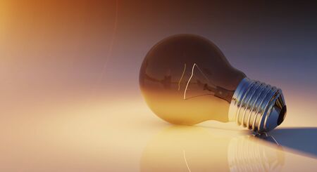 Bright lightbulb on shiny floor with orange light coming from 3D renderingの写真素材