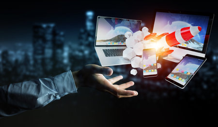 Businessman on blurred background connecting tech devices and startup rocket 3D rendering