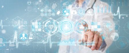 Doctor on blurred background using digital medical futuristic interface 3D renderingの写真素材