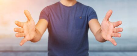 Businessman showing empty hands on blurred backgroundの写真素材