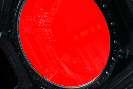 Space station window with red background 3D renderingの写真素材