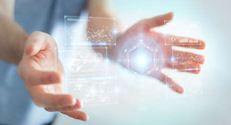 Businessman on blurred background using digital screens interface with holograms datas 3D renderingの写真素材