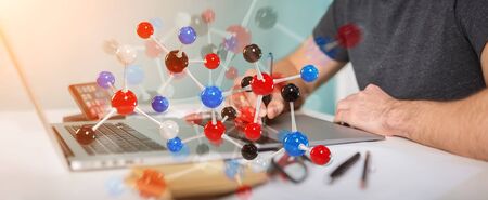 Graphic designer on blurred background using modern molecule structure 3D renderingの写真素材