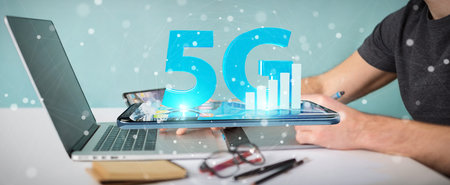 Graphic designer on blurred background using 5G network at the office 3D rendering