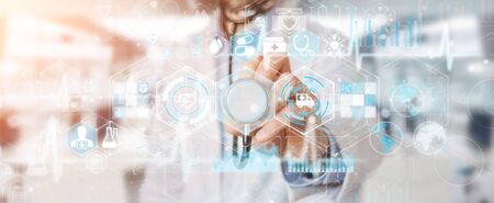 Doctor on blurred background using digital medical futuristic interface 3D renderingの写真素材