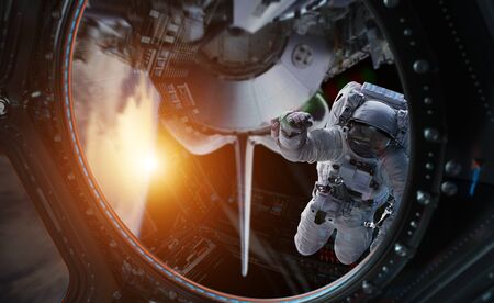Astronaut in space working on a space station 3D rendering elementsの写真素材