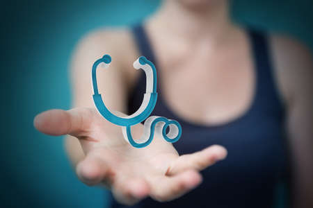 Businesswoman on blurred background holding and touching medical icon 3D renderingの写真素材