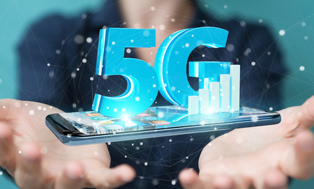 Businesswoman on blurred background using 5G network with mobile phone 3D renderingの写真素材