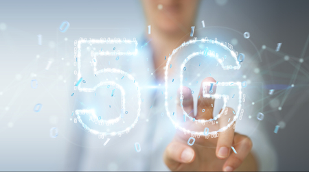 Businesswoman on blurred background using 5G network digital hologram 3D renderingの写真素材