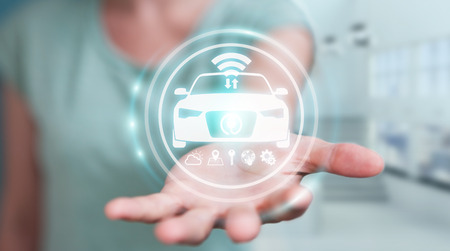 Businesswoman on blurred background modern smart car interface 3D renderingの写真素材