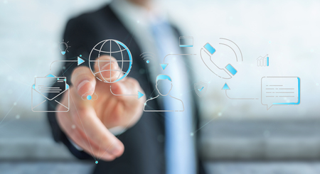 Businessman on blurred background using thin line social network icons interfaceの写真素材