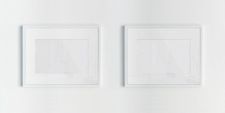 Two white frames hanging on a white textured wall mockup