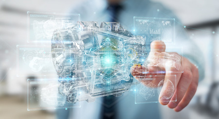 Businessman on blurred background using wireframe holographic 3D digital projection of an engineの写真素材