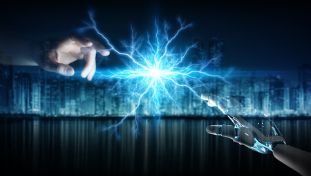 Robot hand creating electricity with human hand on dark background 3D renderingの写真素材