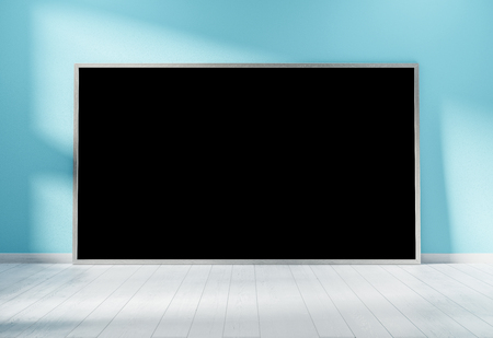 Large horizontal frame leaning on a blue wall in wooden interior 3D renderingの写真素材