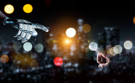 Robot hand making contact with human hand on dark background 3D renderingの写真素材