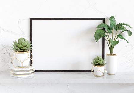 Black frame leaning on white shelve in bright marble interior with plants and decorations mockup 3D renderingの写真素材