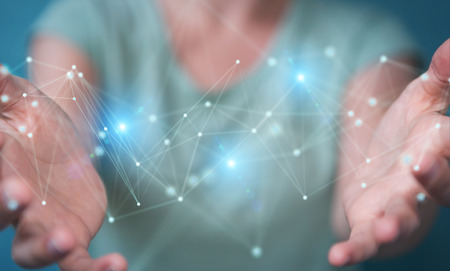 Businesswoman on blurred background using futuristic connection interface 3D renderingの写真素材