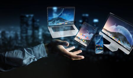 Businessman on dark background connecting modern smartphone tablet laptop and computer 3D renderingの写真素材