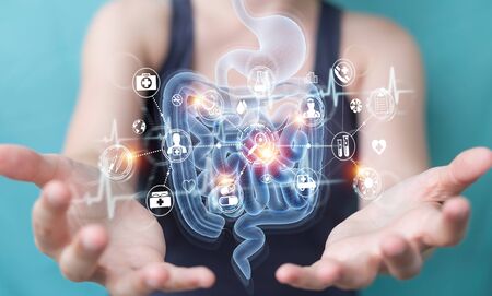 Woman on blurred background using digital x-ray of human intestine holographic scan projection 3D renderingの写真素材