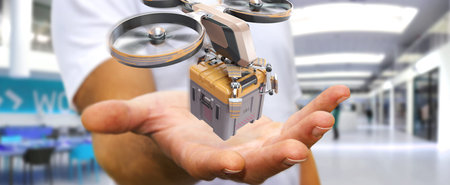 Businessman on blurred background holding and touching delivery drone in his hand 3D renderingの写真素材
