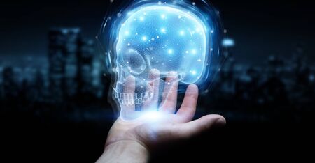 Man hand on dark background using digital x-ray skull holographic scan projection 3D renderingの写真素材