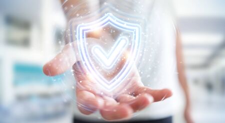 Man on blurred background using digital shield protection blue holographic interface 3D renderingの写真素材