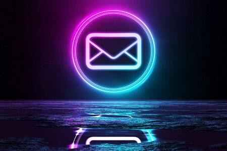 Digital email holographic icon in circle illuminating the floor with blue and pink neon light 3D renderingの写真素材