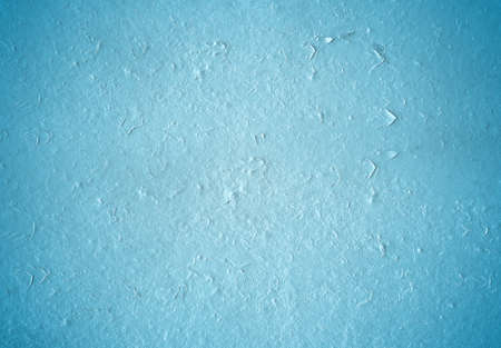Blue grunge texture of a painted wall. Background of damaged paint surfaceの写真素材