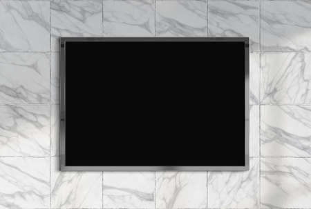 Billboard hanging on a sunlit marble wall mockup. Template of frame bathed in sunlight 3D renderingの写真素材