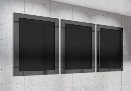 Three vertical frames Mockup hanging on office wall. Mock up of billboards in modern concrete...