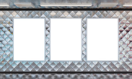 Three vertical billboards on underground subway wall Mockup. Hoardings advertising triptych on train station interior 3D renderingの写真素材