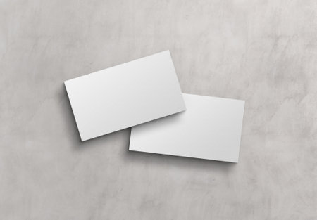 Two white business card Mockup. American size calling card front and back on concrete surface 3D renderingの写真素材