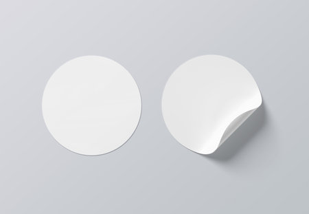 Blank sticker mockup with curled corner isolated on white background. Circular adhesive label with bent side. 3D renderingの写真素材