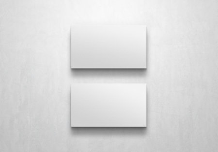 Two Minimalist business cards isolated on white background Mockup. 3D renderingの写真素材