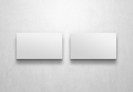 Two Minimalist business cards isolated on white background Mockup. 3D renderingの写真素材