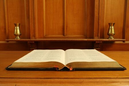 Old bible open in old chapelの写真素材