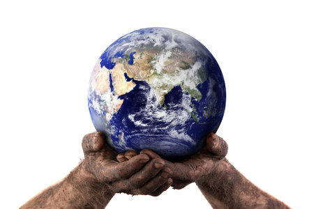 Dirty hands holding the world showing the dry middle east. Isolated on white. Earth image courtesy...