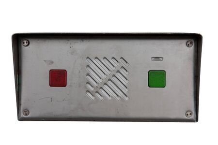 Green and red push buttons on aluminium box. Isolated on whiteの写真素材