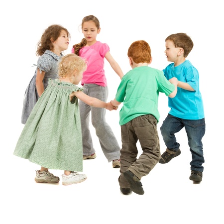 Kids holding hands and playing circle game  On white の写真素材